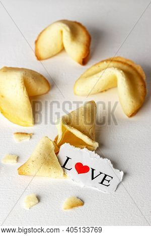 Cookies Shaped Like Tortellini With The Word Love Written On A Paper.vertical Image.
