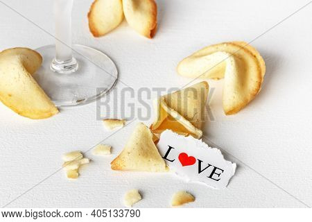 Cookies Shaped Like Tortellini With The Word Love Written On A Paper And A Glass Of Champagne.horizo