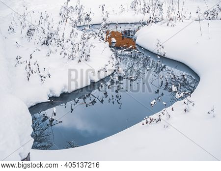 Green Wellspring, The Source Of Natural Mineral Water In The Forest Of Mari El, Russia, Winter Natur