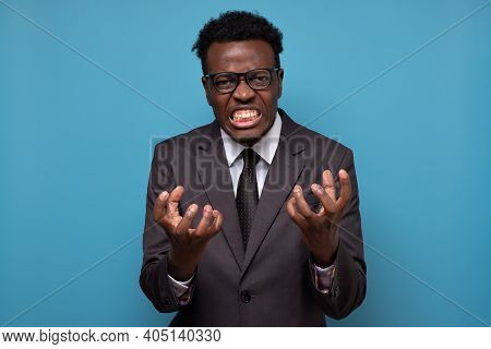 African American Funny Man In Suit Being Furious And Angry Clenching Fingers