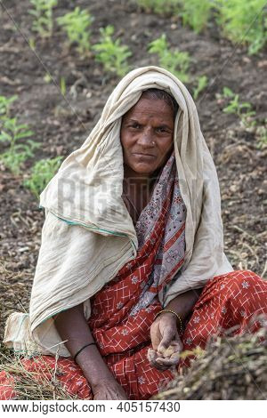 Abbigeri, Karnataka, India - November 6, 2013: Closeup Of Female Peanut Harvester With Beige Sun-pro