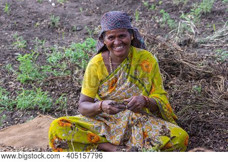 Abbigeri, Karnataka, India - November 6, 2013: Closeup Of Married Female Peanut Harvester With Broad