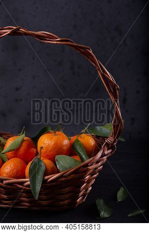 Freshly Harvested Tangerines From Organic Farming Exposed On Dark Background.