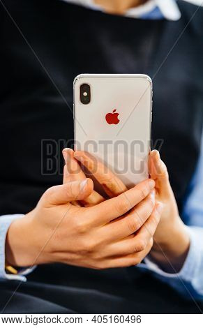 Paris, France - Oct 2, 2018: Close-up Business Woman Hodling New Apple Computers Iphone Smartphone N