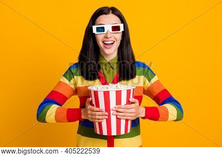 Photo Of Young Excited Amazed Young Girl Watch 3d Movie Hold Popcorn Box Isolated Over Yellow Color 