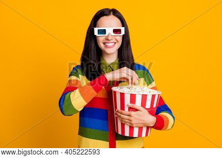 Photo Of Attractive Cheerful Young Girl Smile Watch 3d Movie Eat Pop-corn Isolated Over Yellow Color