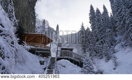 There Is Steam From Barrels With Hot Springs. Warm Radon Clean River. Bridge And Metal Structures Fo