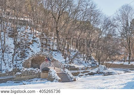 Kislovodsk, Russia - January 23, 2021: Winter Landscape. A Beautiful Bridge Over The Olkhovka River 