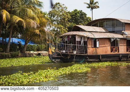 House-boat Pleasure Cruise Ship In India, Kerala On The Seaweed-covered River Channels Of Allapuzha 