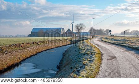 Winter landschape in the countryside from the Netherlands with windmills and farms