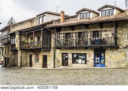 View Of A Facade With Traditional Wooden Galleries In Brown, Comillas, Cantabria In Spain