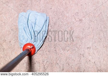 Point Of View Of Mop Is Wiping Linoleum Floor At Home