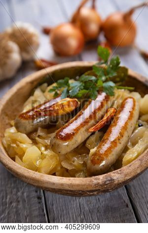 Grilled german sausage links served with sauerkraut or sour cabbage
