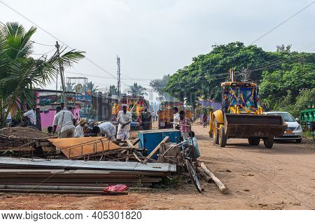 Nandakeshwar, Karnataka, India - November 7, 2013: Streetview Shows Dirt Road Where People Sort Thro
