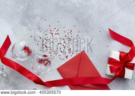 Valentines Day Greeting Card With Red Envelope, Gift Box With Red Ribbon And Bow And Two Vine Glasse