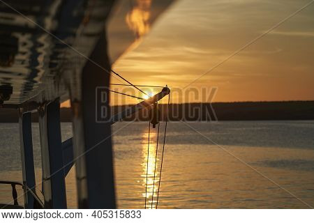 Beautiful And Spectacular Sunset Over A Motor Yacht With Reflections On The White Paint And Details 