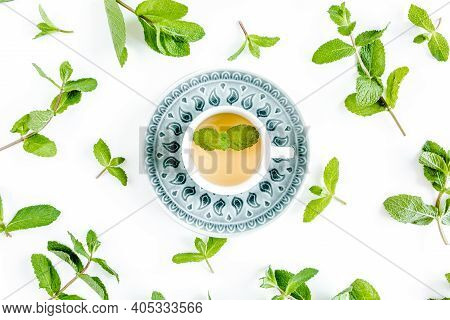 Mint Tea With Frame Made Of Mint Leaves Isolated On White Background. Set Of Peppermint. Mint Patter
