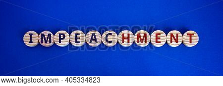 Impeachment Symbol. Wooden Circles With The Word 'impeachment'. Beautiful Blue Background, Copy Spac