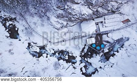 Hot Springs In The Snowy Forest And Mountains. Top View From The Drone On The White Gorge With The R
