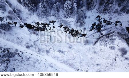 Hot Springs In The Snowy Forest And Mountains. Top View From The Drone On The White Gorge With The R