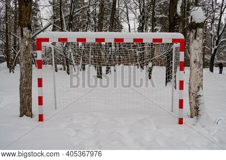 Red And White Football Gates Covered With A Thick Layer Of Snow, Moscow Region