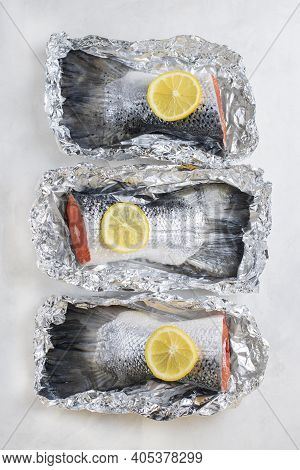 Fresh Raw Salmon Fillet Tail Part With, Lemon On A Light Background. Pescatarian Food Menu, Recipe. 