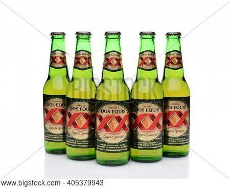 IRVINE, CA - MAY 27, 2014: Five Bottles of Dos Equis Lager Especial on white with reflection. 