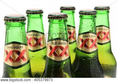 IRVINE, CA - MAY 25, 2014: Closeup of Dos Equis Lager Bottles. Founded in 1890 from the Cuauhtemoc-Moctezuma Brewery in Monterrey, Mexico a subsidary of Heineken International.