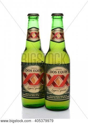 IRVINE, CA - MAY 25, 2014: Two Bottles of Dos Equis Lager Especial with condensation. Founded in 1890 from the Cuauhtemoc-Moctezuma Brewery in Monterrey, Mexico a subsidary of Heineken International.