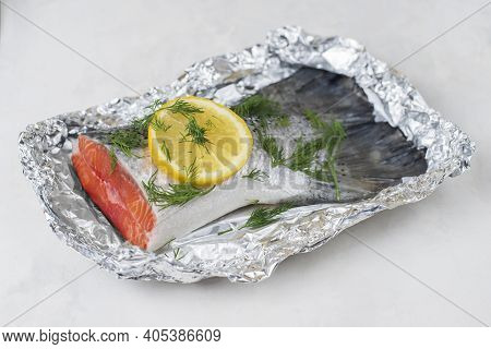 Fresh Raw Salmon Fillet Tail Part With Herbs, Lemon On A Light Background. Pescatarian Food Menu, Re