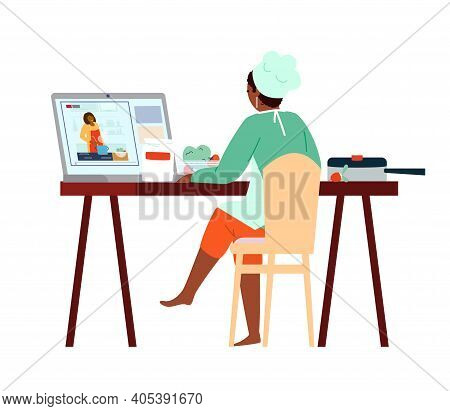 Afroamerican Woman In Chef Hat And Apron Watching Cooking Class Online On Laptop. How-to Guides Vide