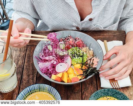 Woman Eating Tasty Colorful Healthy Natural Organic Vegetarian Hawaiian Poke Bowl Using Asian Chopst