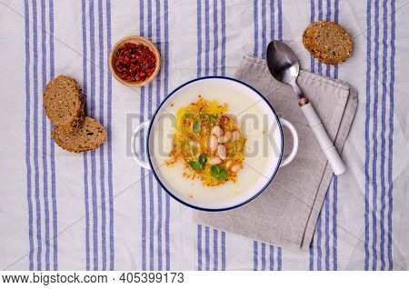 Vegetable Cream Soup With Beans And Spicy Oil In A Bowl On A Textile Background. Selective Focus.