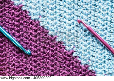 Handmade Close-up Simple Lilac And Blue Crochet Pattern With Crochet Hooks.