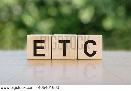 Etc Abbreviation Of Et Cetera Word Written On Wooden Blocks. The Text Is Written In Black Letters An