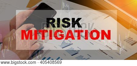 A Man Searches For Information On The Internet About Investments With Risk Mitigation