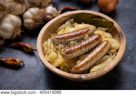 Grilled german sausage links served with sauerkraut or sour cabbage