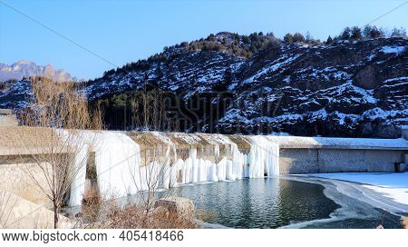Beijing - Jan 1, 2020: A Frozen Water Dam Stream Of Simatai Reservoir During The Winter Season At Gu