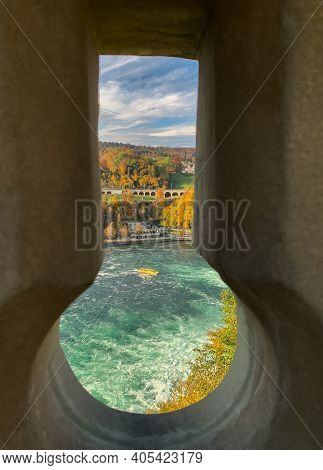 Rhine Falls, Switzerland - October 24, 2020: Autumn Landscape At The Rhine Falls, Largest Waterfall 