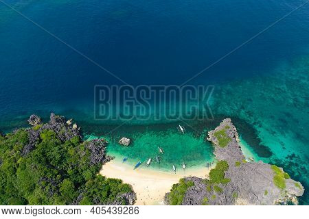 Top View Of Small Tropical Island With White Sandy Beach And Blue Transparent Water. Lahos Island, C