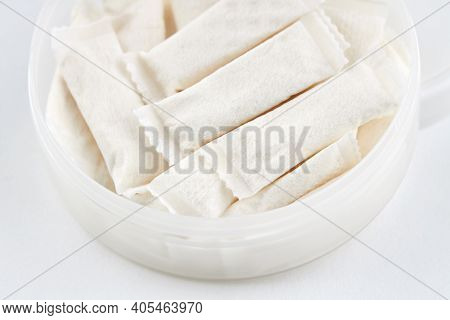 Snus Nicotine Bags. Chewing Tobacco Product Over White Background. Alternative To Smoking Cigarettes