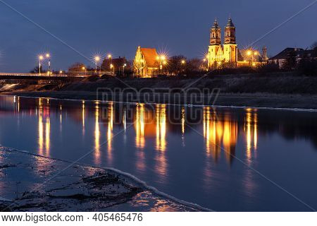 Poznan Cathedral, Archcathedral Basilica Of St Peter And St Paul At Night With Reflection In Warta R