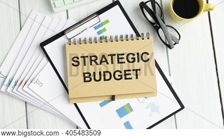 Strategic Budget. The Text Is Written In A Notebok.