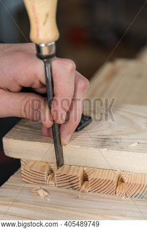 Craftsman Works Wood With Chisels - Close-up Carpenter