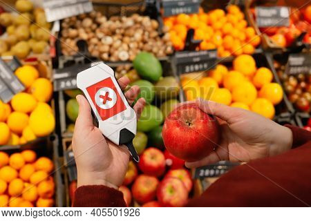 Use Nitrate Tester With Apple. Make Purchases In Supermarket With Device That Checks For Harmful Imp