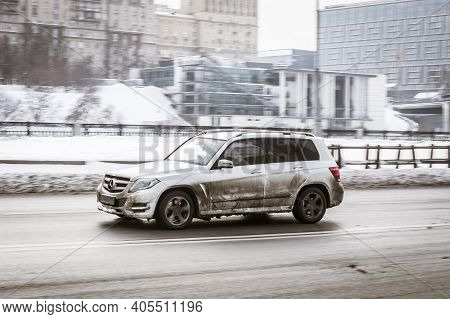 Moscow, Russia - January 15, 2021: Fast Moving Suv Rides On A Winter City Road. A Car In A Snow-cove