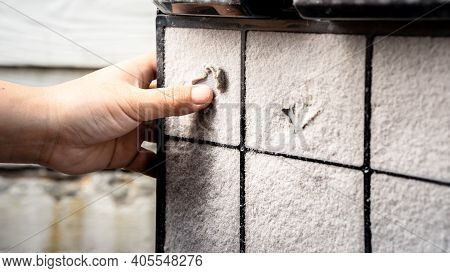 The Human Hand Is Scraping Off The Dust Sheet On The Air Purifier Filter. Clean The Air Filter.