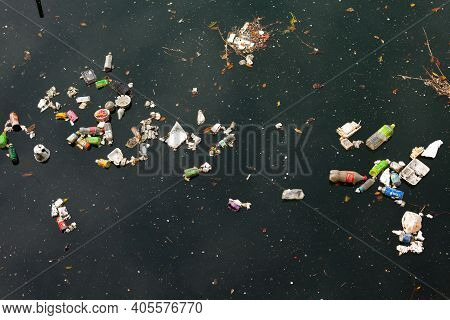 Shiodome Area, Shimbashi, Tokyo, Japan, Asia - April 20, 2010: Trash On A River In Shimbashi, Tokyo