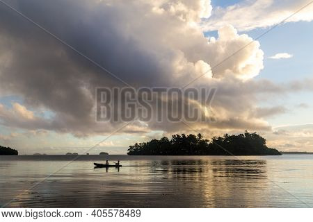 Marovo Lagoon, Solomon Islands - June 5, 2015: Children On The Way To School With A Canoe During Sun