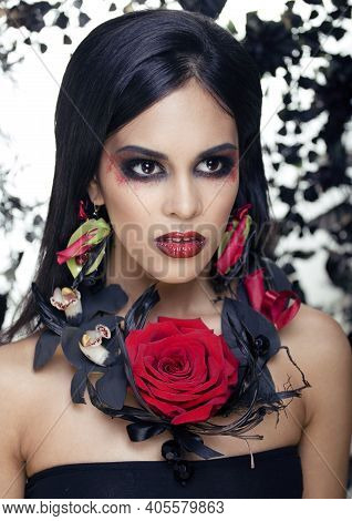Pretty Brunette Woman With Rose Jewelry, Black And Red, Bright Make Up Kike A Vampire Closeup Red Li